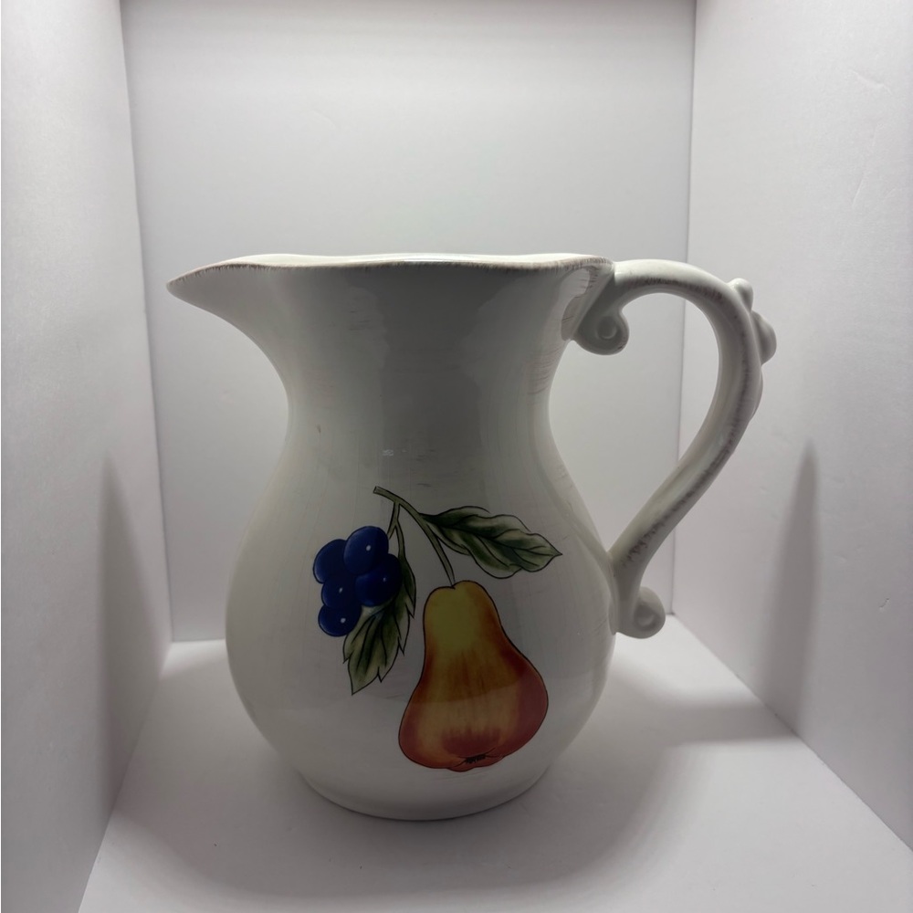 White and Orange Ceramic Art with Fruit Motifs - Picture 3 of 6